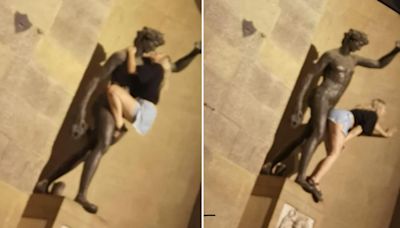 Moment female holidaymaker pretends to ROMP with iconic Florence statue