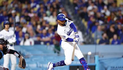 Mookie Betts of the Los Angeles Dodgers singles against the Miami Marlins in the fourth inning at Dodger Stadium on Monday, May 6, 2024, in Los Angeles.