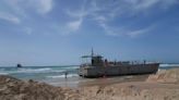 Aid deliveries suspended after rough seas damage US-built temporary pier in Gaza, US officials say