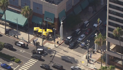Armed suspect arrested after holding person hostage during robbery in Long Beach