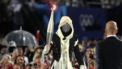 Mystery masked Olympic torchbearer revealed in deleted Instagram post