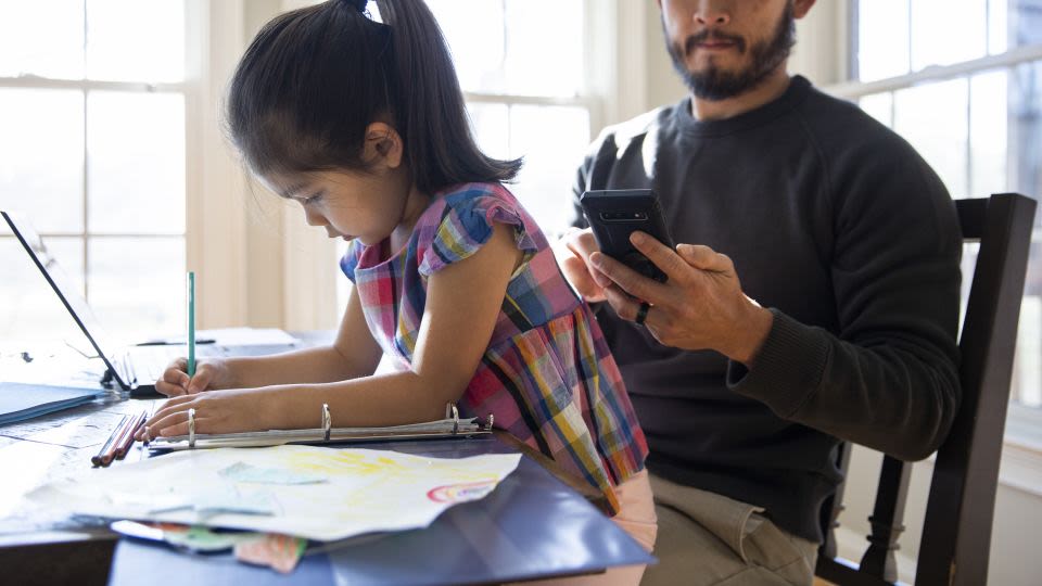 To curb kids’ use of screens, parents may have to cut back on their own