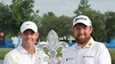 Rory McIlroy and Shane Lowry pose with the trophy after winning the Zurich Classic of New Orleans at TPC Louisiana on Sunday.