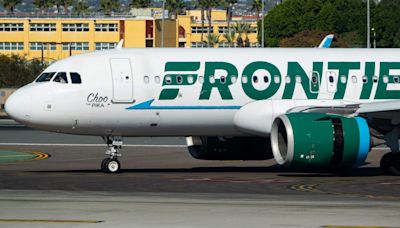 A Frontier passenger sat in an exit row was escorted off the plane in handcuffs after seemingly saying she wouldn't help in an emergency