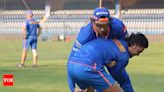 Watch: Ishan Kishan tests wrestling skills against Tim David | Cricket News - Times of India