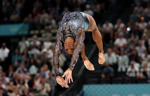 Simone Biles fights through calf injury to produce impressive performance on Olympic return