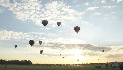 Hot air balloons soar above Louisville on Friday morning for KDF's Great Balloon Rush Hour Race