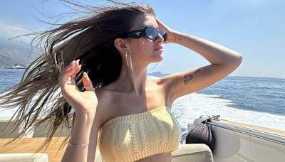 Sami Sheen wows in a bra top and shorts on a boat in Capri