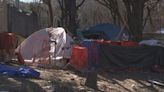 Atlanta city workers inspect homeless encampment near site of bridge fire