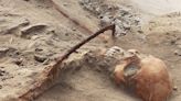 Archeologists discovered a 17th-century Polish 'vampire' with a sickle across its neck meant to prevent a return from the dead