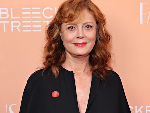 Susan Sarandon is a vision in all white as she cozies up to dashing A-lister