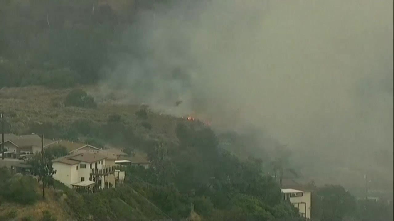 Brush fire breaks out near homes in City Heights