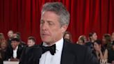 Hugh Grant delivers a masterclass in awkward at the Oscars