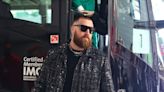 Travis Kelce arrives at Super Bowl 58 in stunning black outfit. Jason Kelce in overalls.