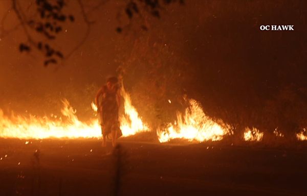 Video shows firefighters rescue woman from blazing Airport fire