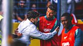 Cristiano Ronaldo grabbed by a fan in chaotic public training session