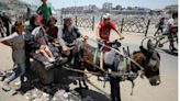 Israel rushes troops into Gaza City, tells Palestinians to move south