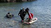 Trash or treasure: Divers sweep Black Rock’s cliff diving waters on lake litter tour