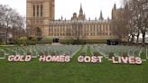 Activists erect ‘headstones’ by Parliament to highlight deaths from cold homes