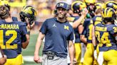 Michigan football coach suspended due to alleged computer crimes