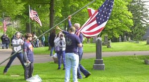 Volunteers raise more than 300 flags to honor veterans at a Westmoreland County cemetery