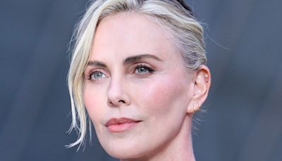 Charlize Theron Looks Statuesque in a Sleek White Minidress at Pre-Olympics Event