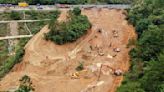 Death toll jumps to at least 48 as the search continues in southern China highway collapse