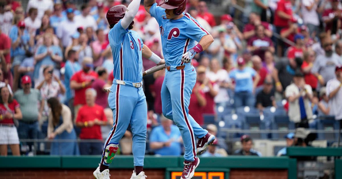 Wheeler tosses 7 strong innings, Realmuto homers as Phillies beat Rangers 5-2 for 3-game sweep