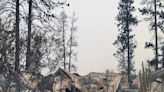 Photos taken by a former firefighter show a scorched landscape filled with smoke in parts of a Washington town destroyed by wildfires