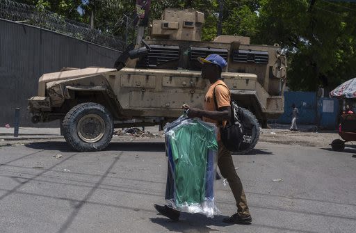 Haiti's transitional council names a new prime minister in the hopes of quelling stifling violence