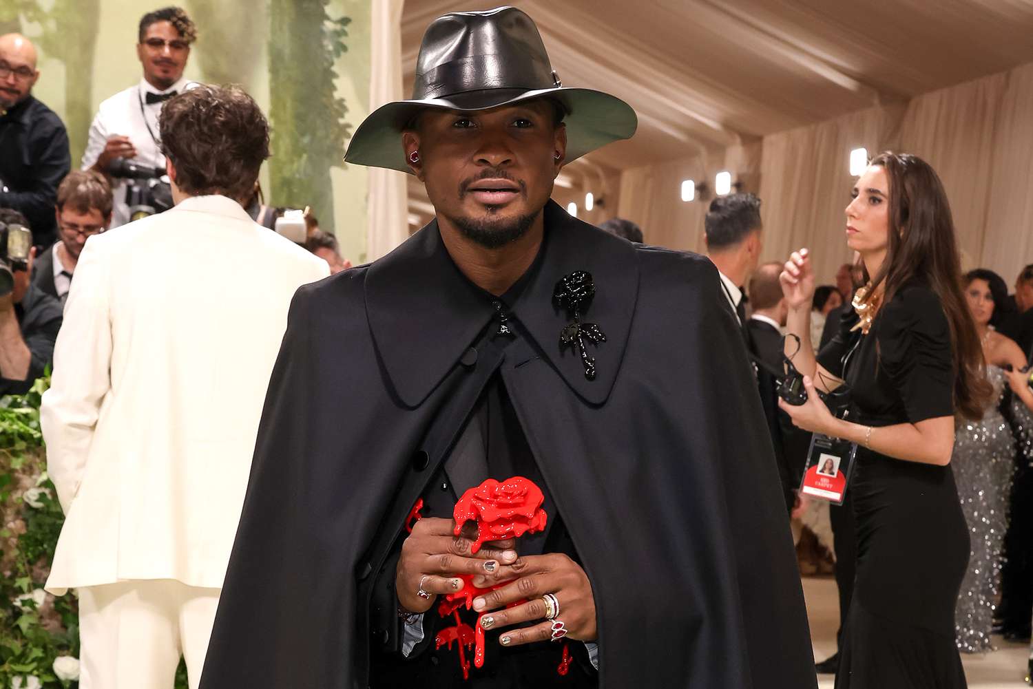 Usher Rocks All-Black 2024 Met Gala Fit — Complete with a Long Cape and Red Rose!