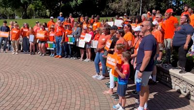 Gun violence awareness advocates gather on the downtown canal for National Gun Violence Awareness Day