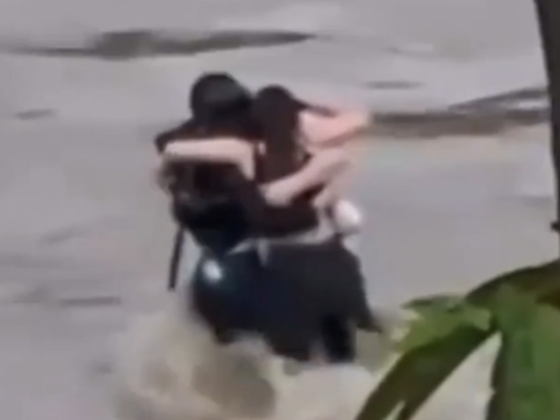 Italy floods: Heartbreaking footage of three friends hugging before being swept away