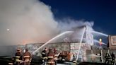 Four-alarm fire burns lumber yard in Oakland