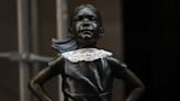 Wall Street's Fearless Girl Dons Signature Collar Of Justice Ruth Bader Ginsburg