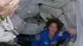 Packed space station welcomes history-making astronaut