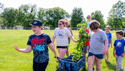 Kansas elementary school students plant exclusive sweetgum that traversed the moon