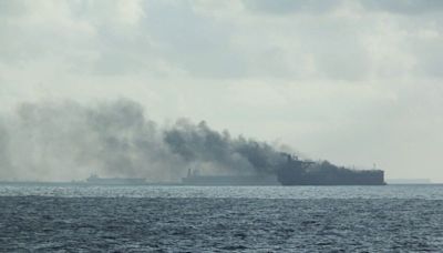 Oil tankers on fire after colliding off Singapore, crew members rescued