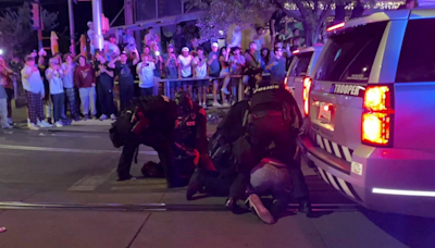 Armed police confront and arrest University of Arizona protesters | CNN