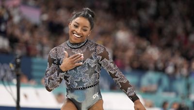 Simone Biles shakes off leg injury to dominate during Olympic gymnastics qualifying