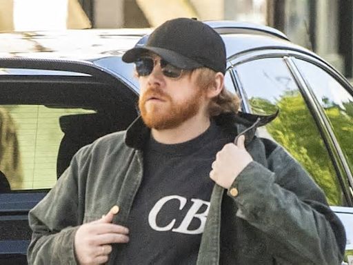 Rupert Grint steps out for a stroll with partner Georgia Groome after his Harry Potter co-star Daniel Radcliffe reignited trans row with JK Rowling