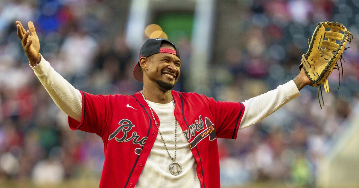 Photos: Usher on the mound before Braves rout Dodgers