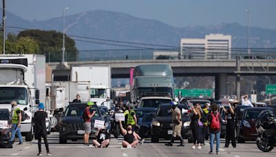 Nine arrested as pro-Palestine protesters shut down rush hour traffic on Los Angeles freeway