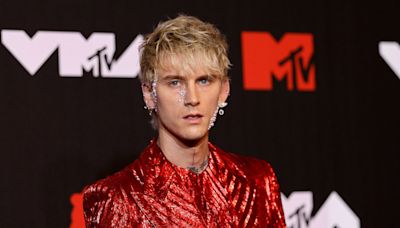 Machine Gun Kelly's major tooth transformation as he debuts fangs