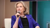 Hillary Clinton Embraces Statement Suiting With Vibrant Purple Blazer and Accessories at Vital Voices Global Festival 2024