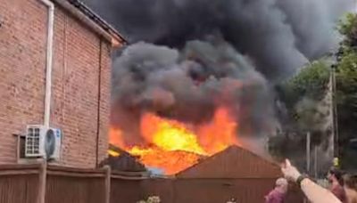 Resident 'ran out of door' as fire tore through sheds