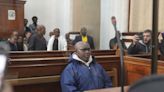 Rwandan genocide suspect appears in court holding Bible after 22 years on the run