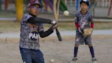 Baseball becomes a shelter for Venezuelan children in soccer-mad Peru