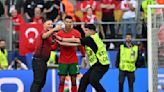 Martinez hails team player Ronaldo while critical of pitch invaders