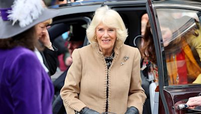 Queen Camilla Holds ‘Send Love to Kate’ Sign During Outing After Daughter-in-Law’s Cancer News